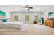 Spacious main bedroom with tray ceiling, carpeted floor, ample natural light, and comfortable furniture at 1112 Cordia Nw Ave, Atlanta, GA 30318