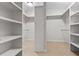 Spacious walk-in closet with built-in shelving and carpeted floor offers ample storage space at 1112 Cordia Nw Ave, Atlanta, GA 30318