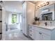 Modern bathroom with a soaking tub and white cabinetry, and a great view of outdoors at 240 Patterson Se Ave, Atlanta, GA 30316