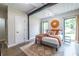 Bedroom features hardwood floors, a plush rug, and natural lighting at 240 Patterson Se Ave, Atlanta, GA 30316