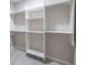 Walk in closet with built-in shelving units and chrome hanging racks at 240 Patterson Se Ave, Atlanta, GA 30316