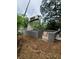 Construction of the modular home's basement, with a shipping container being lifted by a crane at 240 Patterson Se Ave, Atlanta, GA 30316