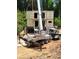 Shipping container home construction, with crane lifting the modular containers at 240 Patterson Se Ave, Atlanta, GA 30316