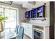 Dining room boasting stylish, blue-lit shelving, wine storage, and modern decor at 240 Patterson Se Ave, Atlanta, GA 30316