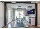 Dining room with a glass table, modern lighting, and access to the outdoor patio at 240 Patterson Se Ave, Atlanta, GA 30316