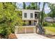 Two-story home with modern architecture, balconies, and an attached two-car garage at 240 Patterson Se Ave, Atlanta, GA 30316