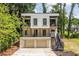 Contemporary two-story home with a front-facing two-car garage and steel staircase at 240 Patterson Se Ave, Atlanta, GA 30316