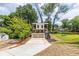 Modern two-story home featuring a concrete driveway, two-car garage, and upper and lower level metal balconies at 240 Patterson Se Ave, Atlanta, GA 30316