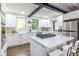 Bright, modern kitchen with stainless steel appliances, and a quartz countertop island at 240 Patterson Se Ave, Atlanta, GA 30316