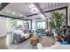 Open-concept living room adjacent to a modern white kitchen with stainless appliances at 240 Patterson Se Ave, Atlanta, GA 30316