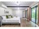Comfortable main bedroom with a balcony and modern ceiling details and decor at 240 Patterson Se Ave, Atlanta, GA 30316