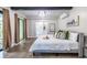 Stylish main bedroom with a balcony, modern ceiling detail and an ensuite bathroom at 240 Patterson Se Ave, Atlanta, GA 30316