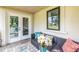 Inviting patio with comfortable seating, stylish outdoor rug, and view of a garden landscape at 240 Patterson Se Ave, Atlanta, GA 30316