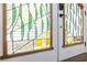 Up close detail of custom stained glass on entry doors at 240 Patterson Se Ave, Atlanta, GA 30316