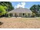 Spacious backyard featuring a patio with seating and a well-maintained lawn at 2735 Princeton Trce, Cumming, GA 30041