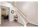 Foyer with hardwood floors, staircase, neutral paint, and access to the living room at 2735 Princeton Trce, Cumming, GA 30041