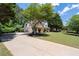 Charming two-story home with a manicured lawn, brick facade, black shutters, and inviting front porch at 2735 Princeton Trce, Cumming, GA 30041