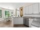 Eat-in kitchen featuring a breakfast nook, granite countertops, stainless steel appliances, and white cabinets at 2735 Princeton Trce, Cumming, GA 30041