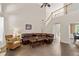 Bright living room with wood floors and an open staircase at 2735 Princeton Trce, Cumming, GA 30041