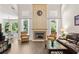 Elegant living room boasts fireplace and views into dining area at 2735 Princeton Trce, Cumming, GA 30041