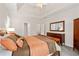 Main bedroom boasting tray ceilings, carpeted floors, spacious layout, and ample natural light at 2735 Princeton Trce, Cumming, GA 30041