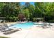 Community pool featuring ample seating and well-manicured landscaping at 2735 Princeton Trce, Cumming, GA 30041