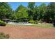 Inviting community pool area with lounge chairs, gazebos, and a playground at 2735 Princeton Trce, Cumming, GA 30041