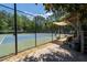 Well-maintained tennis courts surrounded by lush trees and greenery at 2735 Princeton Trce, Cumming, GA 30041