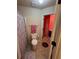 Cozy bathroom featuring tile floors, a polka-dot shower curtain, and an adjacent doorway at 4316 Kershaw Dr, Snellville, GA 30039