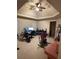 Spacious bedroom featuring a ceiling fan, home office setup and exercise equipment at 4316 Kershaw Dr, Snellville, GA 30039