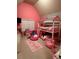 Pink bedroom with bunk beds, a play area, and carpeted floors at 4316 Kershaw Dr, Snellville, GA 30039