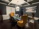 Sophisticated dining room with unique chandelier, dark walls, and seating for six at 4316 Kershaw Dr, Snellville, GA 30039