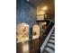 Open foyer with a staircase, dark wood flooring, and views into the living room at 4316 Kershaw Dr, Snellville, GA 30039