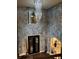Stunning foyer with tall ceilings, wood floors, grand chandelier, and artistic wall texture at 4316 Kershaw Dr, Snellville, GA 30039