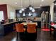 Modern kitchen featuring dark cabinets, stainless steel appliances, and a center island at 4316 Kershaw Dr, Snellville, GA 30039