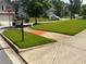 Street view of a home and well-maintained lawn, plus a visible street address at 4316 Kershaw Dr, Snellville, GA 30039