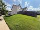 A lush, green lawn and fenced backyard offer a private outdoor space at 4316 Kershaw Dr, Snellville, GA 30039