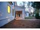 Covered back porch with a stone floor and a view to the backyard at 4550 Jolyn Pl, Sandy Springs, GA 30342