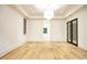 Bright bedroom featuring hardwood floors, white walls and tray ceiling at 4550 Jolyn Pl, Sandy Springs, GA 30342