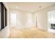 Bright bedroom with wood floors plus view into two additional bathrooms at 4550 Jolyn Pl, Sandy Springs, GA 30342