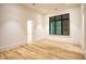 Bedroom features hardwood floors and a large window, with neutral paint at 4550 Jolyn Pl, Sandy Springs, GA 30342