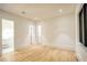 Large bedroom featuring hardwood floors and an adjacent bathroom with glass shower at 4550 Jolyn Pl, Sandy Springs, GA 30342