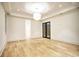 Spacious bedroom with wood floors, recessed lighting and French doors at 4550 Jolyn Pl, Sandy Springs, GA 30342