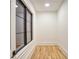 Small bedroom featuring hardwood floors and a dark-framed window at 4550 Jolyn Pl, Sandy Springs, GA 30342