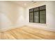 Bright bedroom features hardwood floors, a large window, and neutral paint at 4550 Jolyn Pl, Sandy Springs, GA 30342