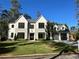 Beautiful new construction home with a 3-car garage and an expansive front yard at 4550 Jolyn Pl, Sandy Springs, GA 30342