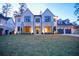 Beautiful two-story home with lush lawn, stone facade, and three-car garage at 4550 Jolyn Pl, Sandy Springs, GA 30342