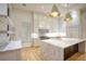 Gourmet kitchen features marble countertops, custom cabinets, and pendant lighting at 4550 Jolyn Pl, Sandy Springs, GA 30342