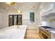 Bright kitchen with marble countertops, island, stainless steel appliances and hardwood floors at 4550 Jolyn Pl, Sandy Springs, GA 30342