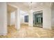 Open-concept living space showcasing elegant lighting and herringbone-patterned wood floors at 4550 Jolyn Pl, Sandy Springs, GA 30342